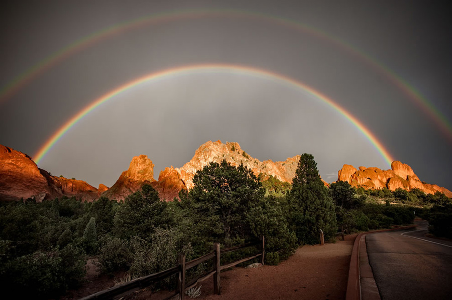Double rainbow over Garden of the Gods in Colorado Springs, CO. Did you know there really isn’t an “end” to a rainbow? Maybe that’s why finding a pot of gold is as hard as spotting a tricky leprechaun. If you stood at where I can see the “proverbial” end of the rainbow, then that rainbow would appear to you to be in a different spot. It’s one of nature’s very best optical “illusion” tricks. Experiencing the phenomenon depends upon where you are standing, where the sun is and where the moisture is just right in the air. Rainbows, especially double rainbows, are considered a positive, awe-inspiring sign in most cultures. Photo #1 by Raymond Larose