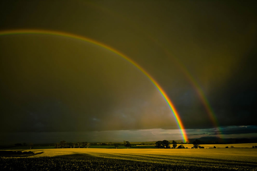 Double rainbow over the Merse, Scotland. After the great flood and Noah’s famous Ark, came a rainbow that God said is His promise never to flood and destroy the entire earth again. But rainbows are so spectacular, that these multicolored arcs are woven into all kinds of legends, folklore, mythology and religions. Photo #7 by Neal Fowler