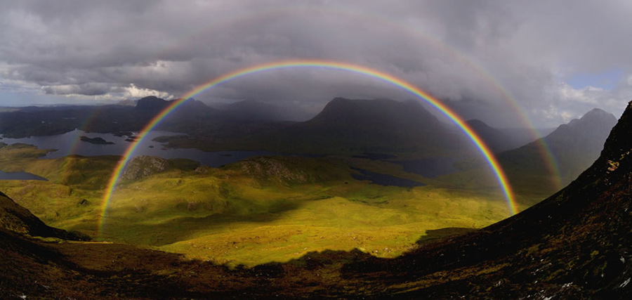 The photographer wrote, “Just as we reached the saddle of Stac Polaidh we were rewarded with the best rainbow(s) I have ever seen. Looking north across Loch Sionascaig to Suilven. Cul Mor and Cul Beag to the right.” Photo #13 by David Ian Roberts