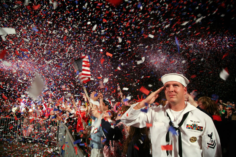 Sailor-salutes-as-the-American-flag-is-presented-on-stage-during-the-Boston-Pops-Fireworks-Spectacular-at-the-Charles-River-Esplanade-July-4th