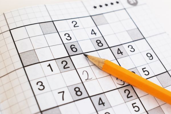close-up-of-sudoku-game-and-yellow-pencil-focus-on-a-pencil-1